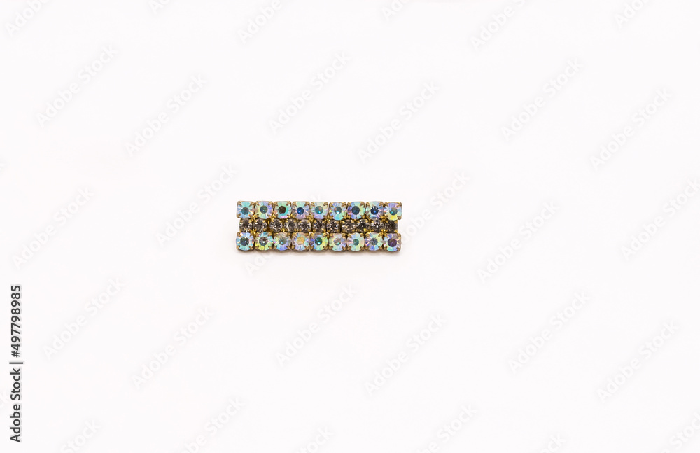 Rectangle golden brooch with crystals, isolated on white. Rectangle golden brooch with crystals, isolated on white.