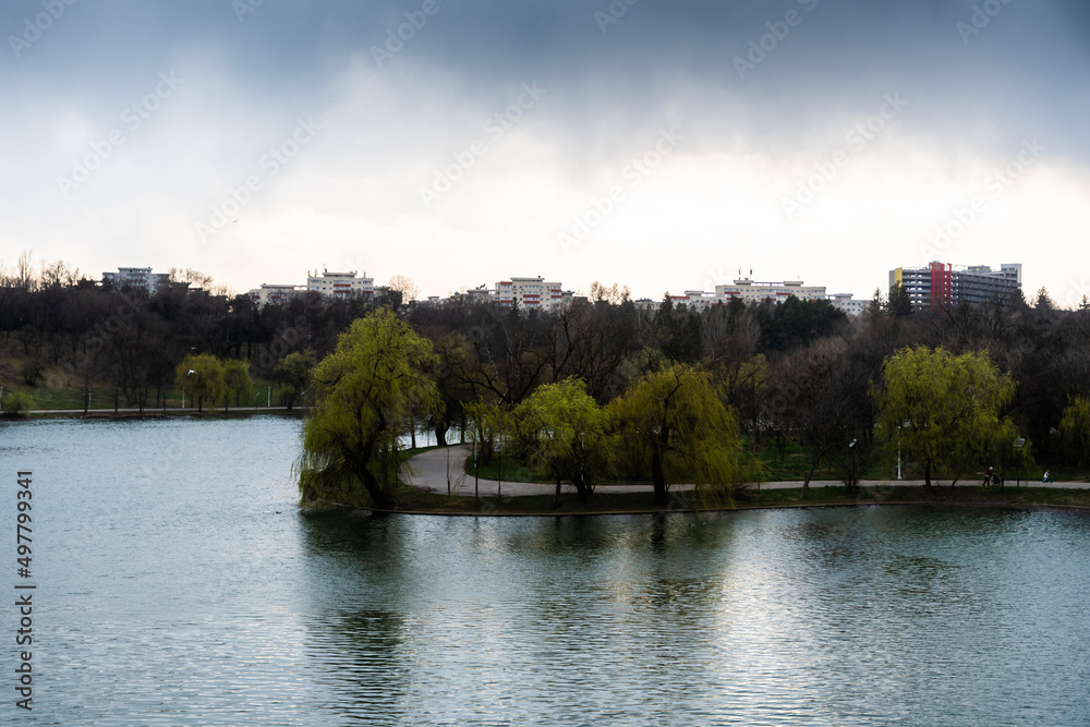 Landscape over the lake from Tineretului park in a cloudy day, Bucharest, Romania. Landscape over the lake from Tineretului park in a cloudy day, Bucharest, Romania.