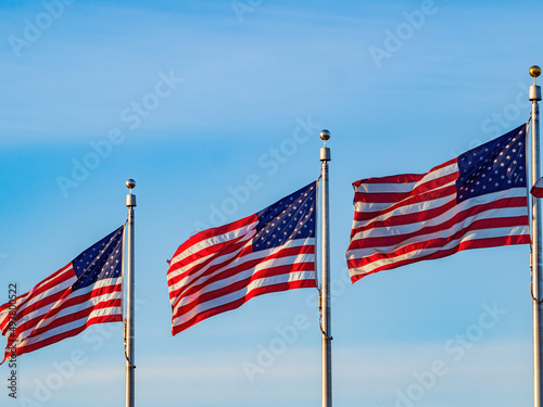 Close up shot of many American flag swinging