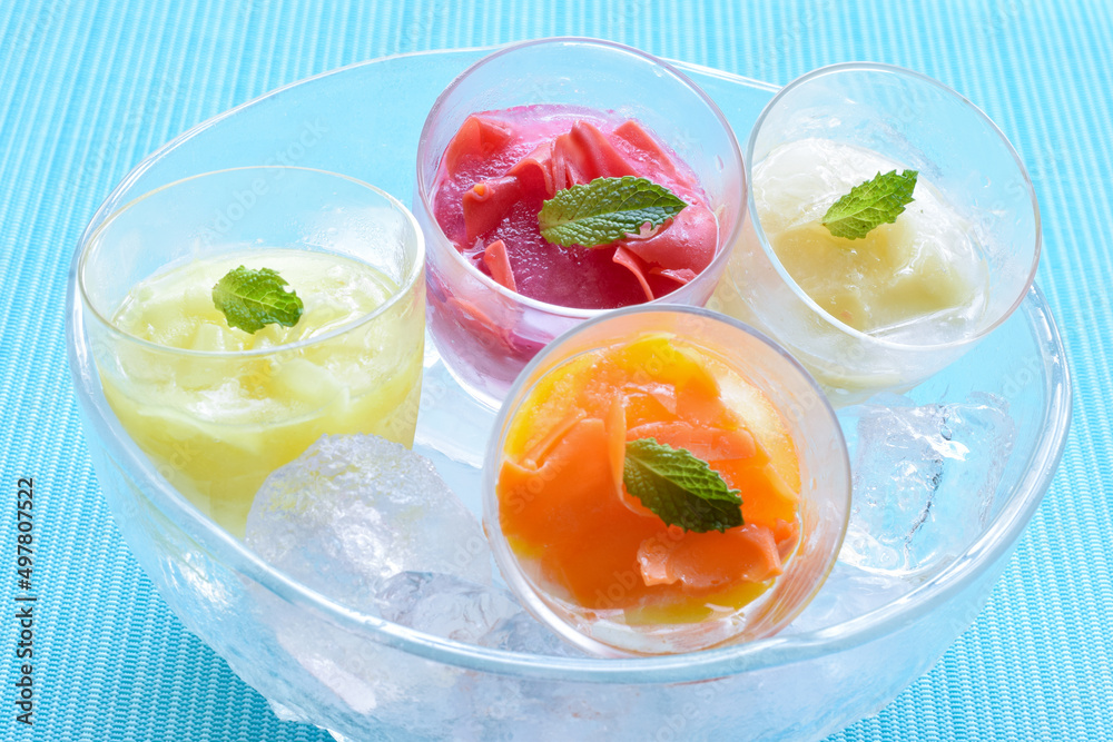 Four kind of Fruits Sorbet with ice in the bowl, Summer image, Blue background Four kind of Fruits Sorbet with ice in the bowl, Summer image, Blue background