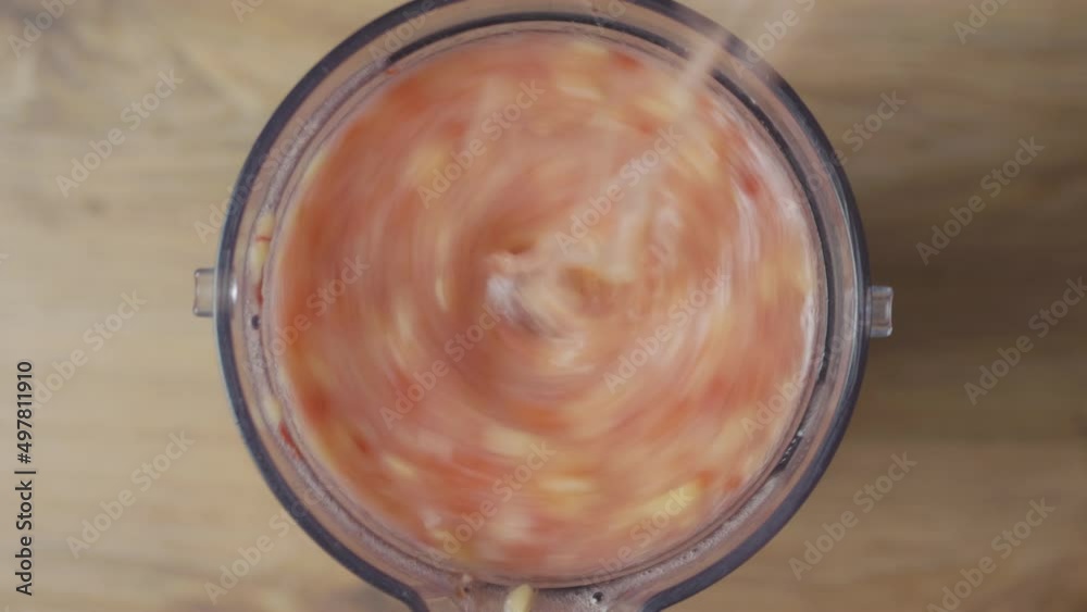 Two handfuls of sliced bananas and two handfuls of chopped strawberries putting in a blender and mixing with yogurt, making a healthy antioxidant smoothie, top macro view. Two handfuls of sliced bananas and two handfuls of chopped strawberries putting in a blender and mixing with yogurt, making a healthy antioxidant smoothie, top macro view.
