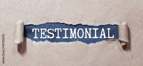 Testimonial - word from wooden blocks with letters, statement about the character or qualities testimonial concept
