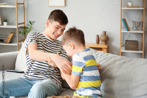 Cute brothers having fun at...