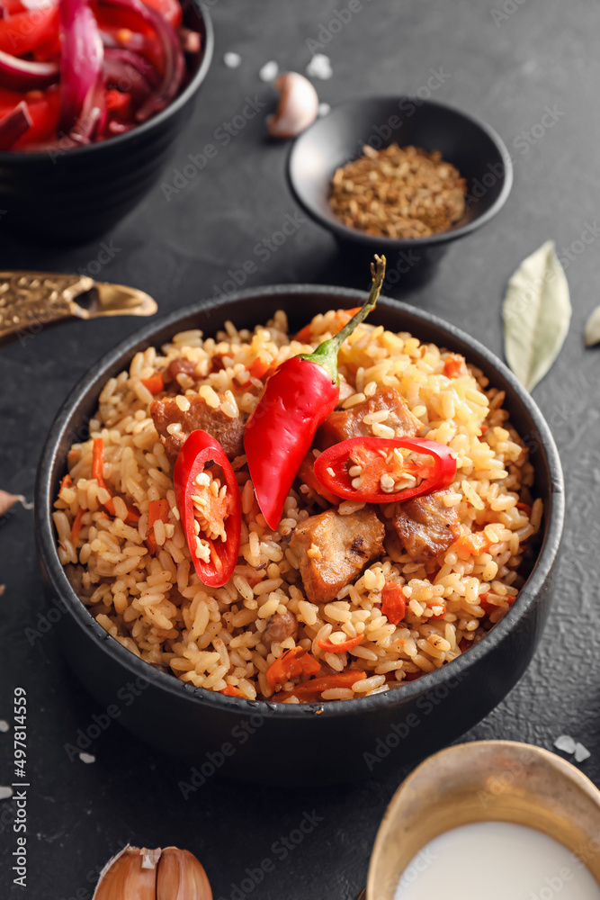 Bowl of traditional pilaf on dark background Bowl of traditional pilaf on dark background