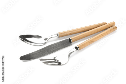 Set of stainless steel cutlery with wooden handles on white background