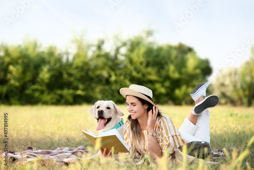 Woman with cute Labrador re...