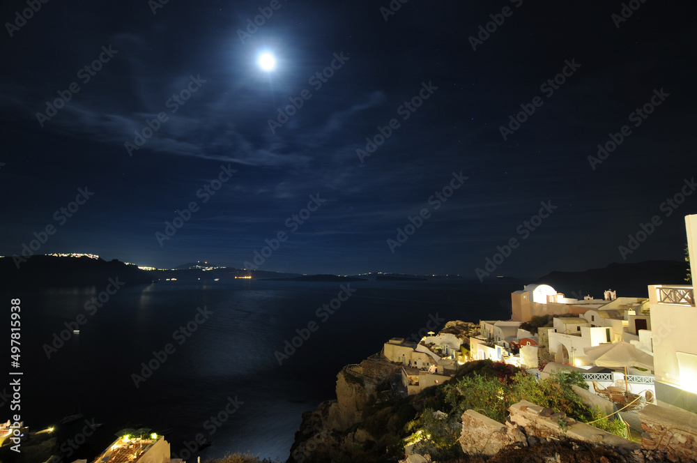 Sunset night view of traditional Greek village Oia on Santorini island in Greece.