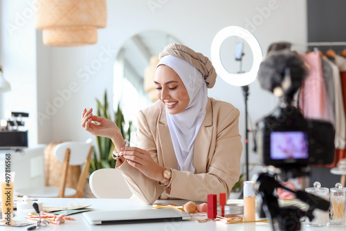 Muslim beauty blogger recording video in dressing room