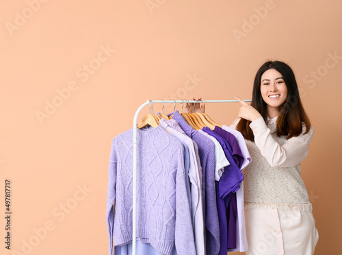 Young Asian woman pointing ...