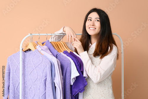Young Asian woman and rack ...