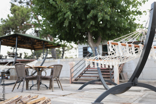 Interior of summer cafe and a hammock