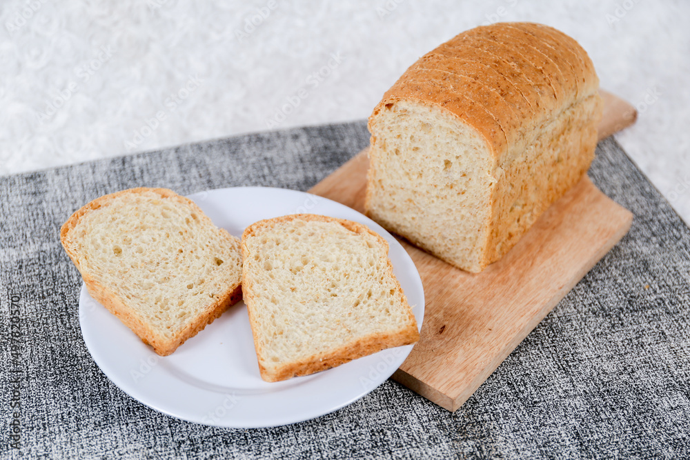 Wheat bread loaf on a white background.
Wheat bread loaf on a white background.