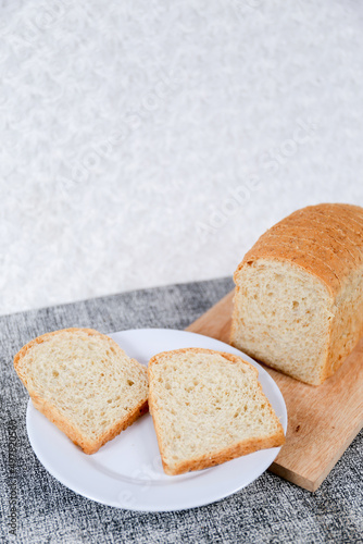 Wheat bread loaf on a white background. 