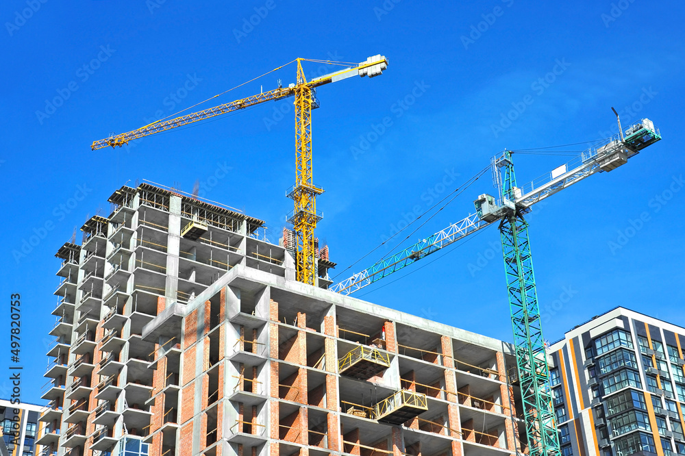 Crane and highrise construction site Crane and highrise construction site