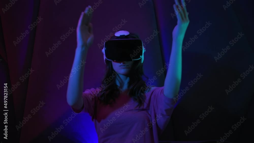 Woman Using Virtual Reality Headset Looking Around At Interactive Future VR Education Technology And New Technologies Diversity Concept