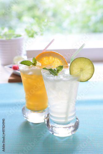 Summer Concept, Orange soda and lime soda with mint at the window