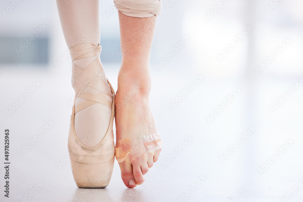 I should definitely tape my feet more often. Cropped shot of a young  ballerina wearing a pointe shoe on one foot and band aids on her barefoot.  Stock Photo | Adobe Stock