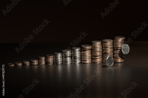 stacks of coins on a black background