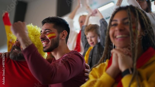 Spanish football fans celebrating their team's victory at stadium.