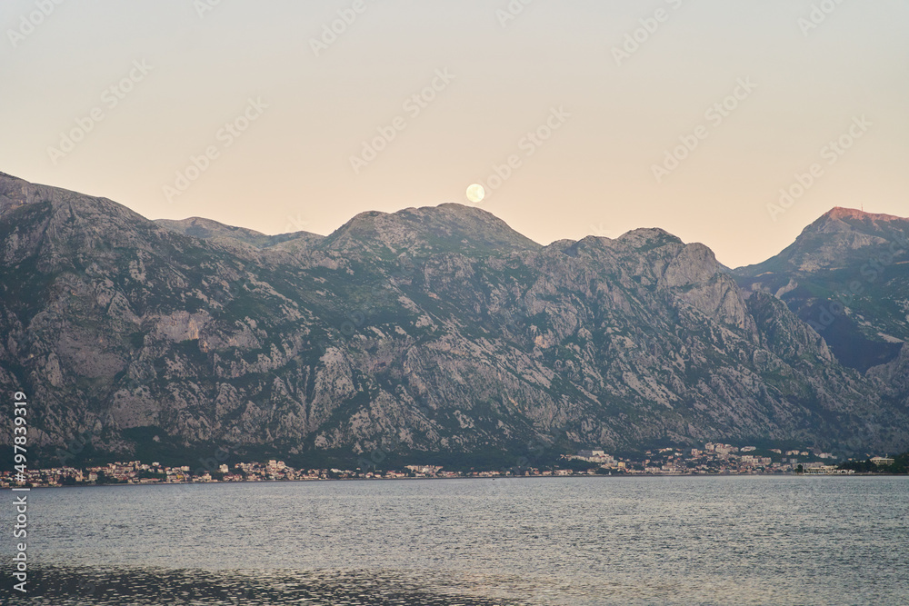 View of the sunset in Boko-Kotor Bay in Montenegro. Silhouettes of mountains