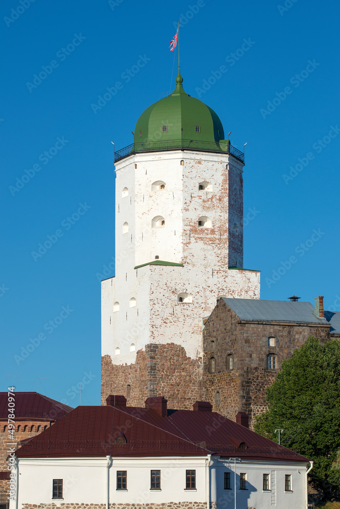 Saint Olaf's tower against a blue cloudless sky. Vyborg castle. Leningrad region, Russia