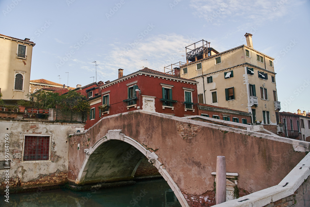 Venice, Italy - October 13, 2021: Bridge over the canal in Venice. Streets of the Italian city of Venice