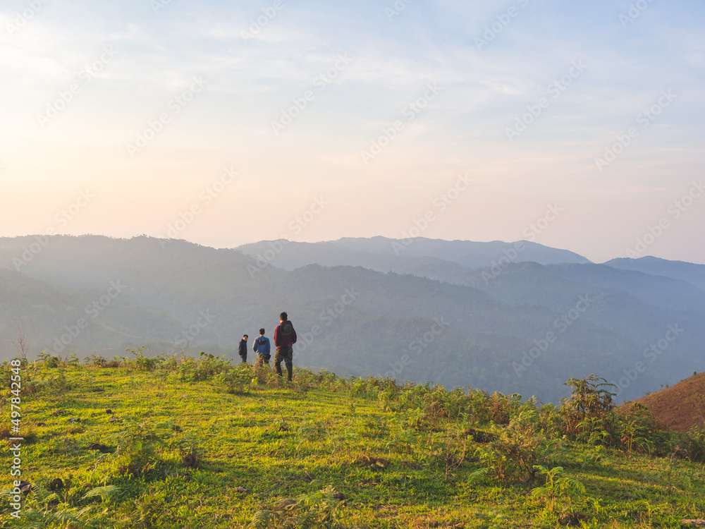 Trekking group enjoying on mountain trail in tropical forest at Tak Province, Thailand.