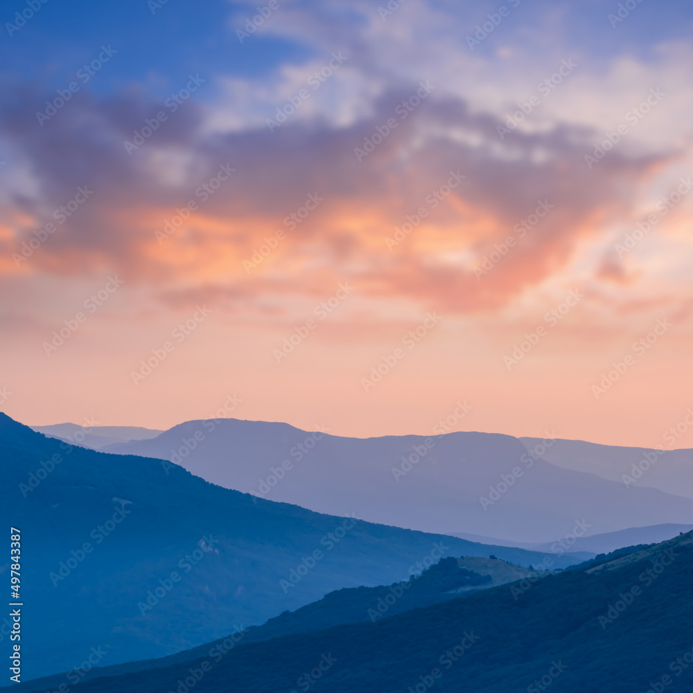 mountain ridge silhouette in blue mist at the twilight, natural mountain landscape mountain ridge silhouette in blue mist at the twilight, natural mountain landscape