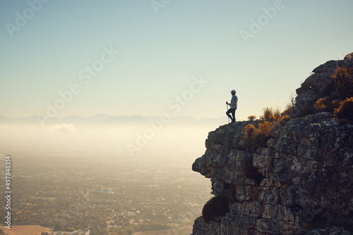 There is tranquility in nature. Shot of a mature woman standing on a mountain in nature.