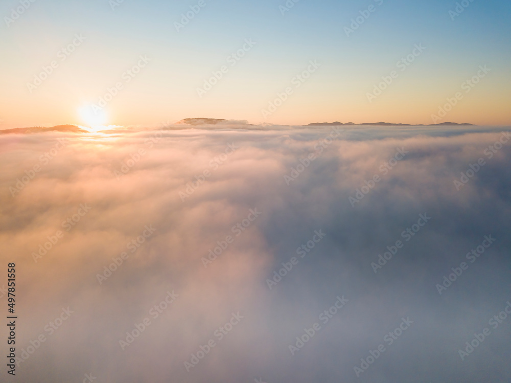Sunrise over the fog in the Ukrainian Carpathians. Aerial drone view. Sunrise over the fog in the Ukrainian Carpathians. Aerial drone view.