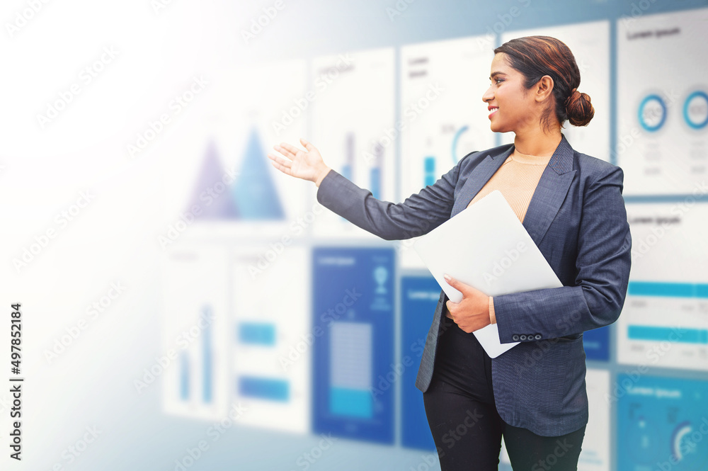 Energetic Indian woman presenting annual reports of the successful business company Energetic Indian woman presenting annual reports of the successful business company