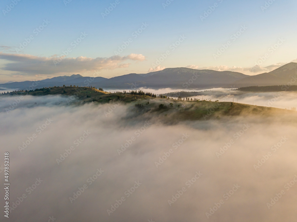 Fototapeta premium Morning fog in the Ukrainian Carpathians. Aerial drone view.