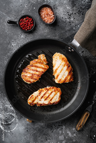 Fried schnitzel set, on black dark stone table background, top view flat lay