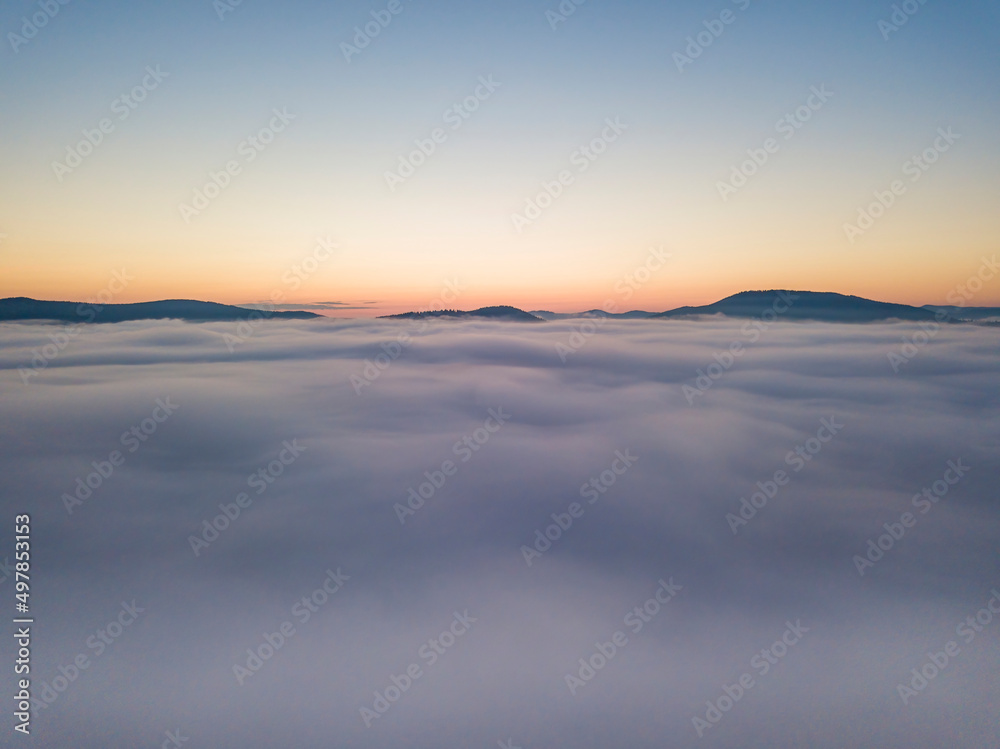 Morning fog in the Ukrainian Carpathians. Aerial drone view.