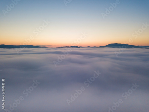 Morning fog in the Ukrainian Carpathians. Aerial drone view.