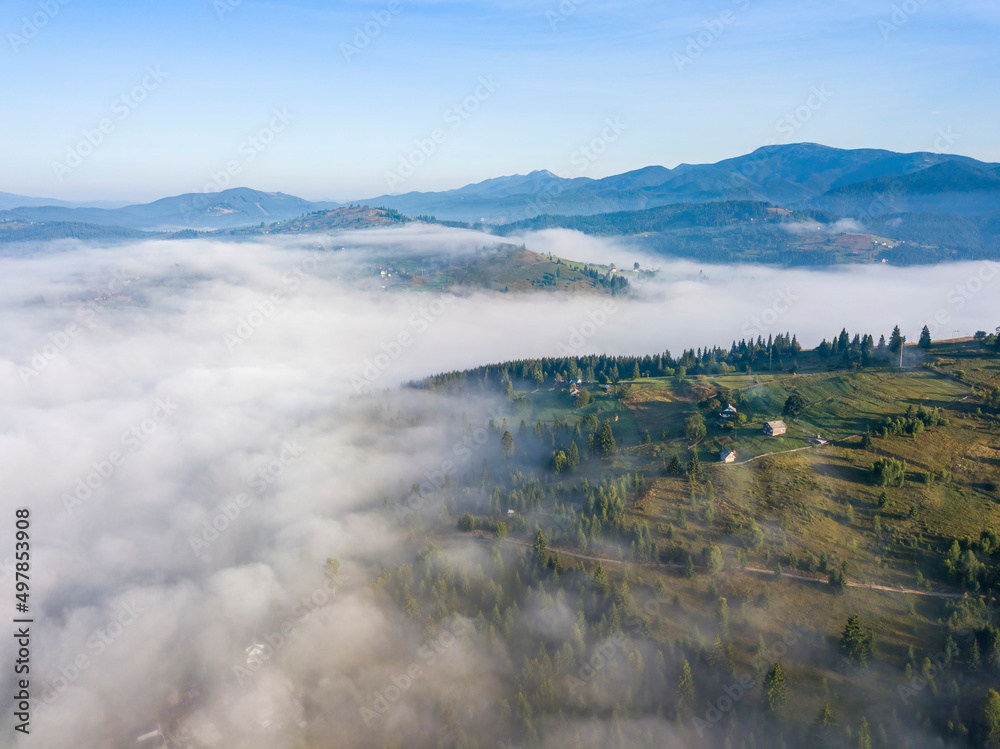 Morning fog in the Ukrainian Carpathians. Aerial drone view.