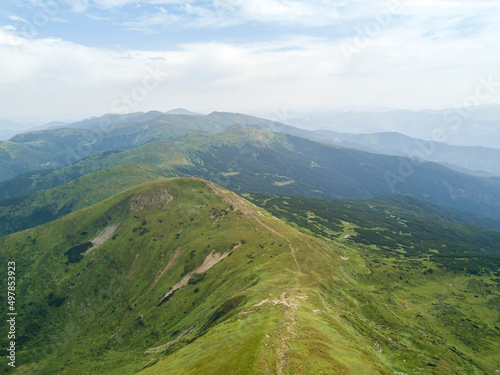 High mountains of the Ukrainian Carpathians in cloudy weather. Aerial drone view.