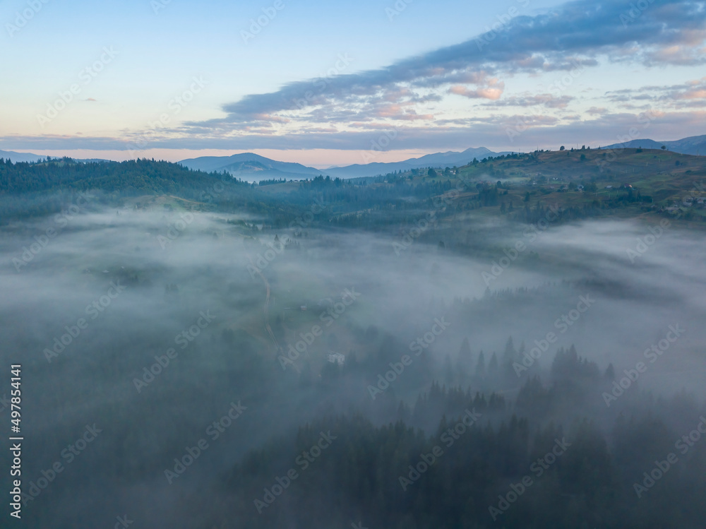 Morning fog in the Ukrainian Carpathians. Aerial drone view.