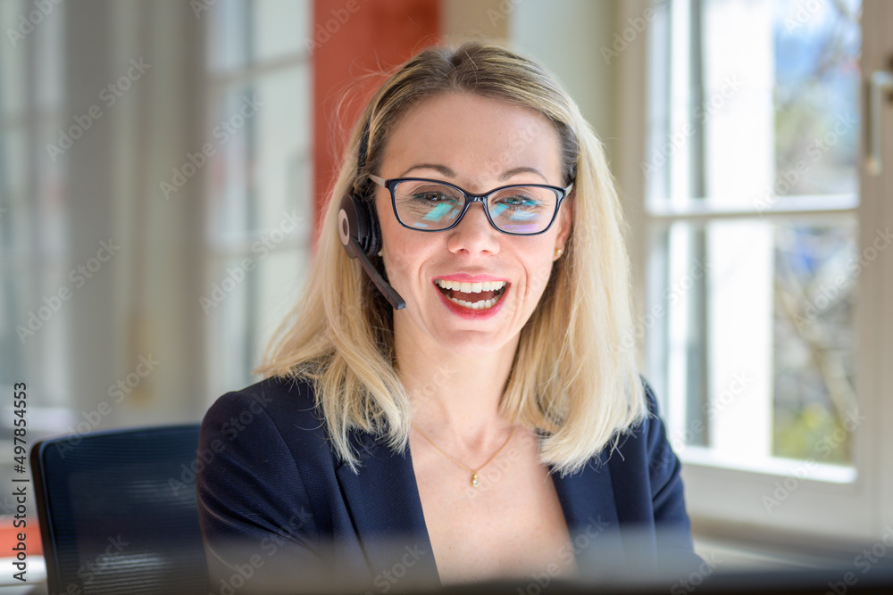Happy smiling businesswoman laughing at the camera Happy smiling businesswoman laughing at the camera