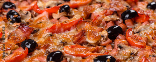 Homemade vegetable pizza with addition of tomatoes, olives and herbs
