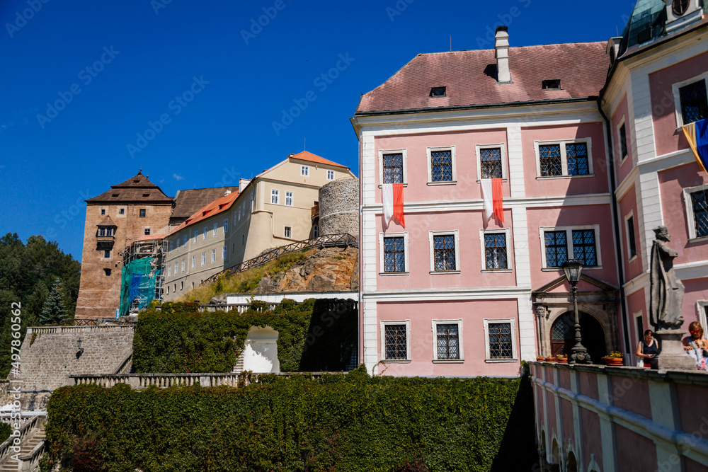 Becov nad Teplou, West Bohemia, Czech Republic, 14 August 2021: Medieval gothic castle and lower baroque chateau with defense tower and residential palace, ancient bastion at summer sunny day