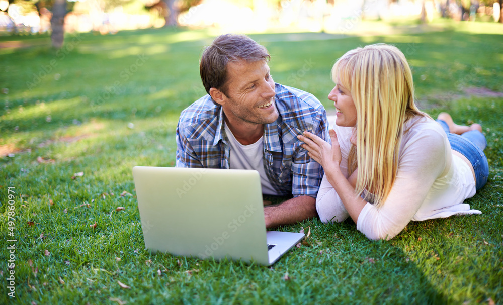 No fair, thats cheating.... Cropped shot of an attractive couple using a laptop outdoors. No fair, thats cheating.... Cropped shot of an attractive couple using a laptop outdoors.