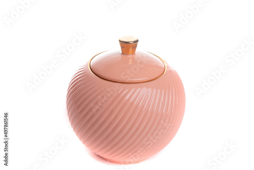 round stylish peach colored porcelain sugar bowl on white isolated background