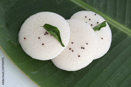 Idly , Idli is a traditional breakfast of South India served on banana leaf photo