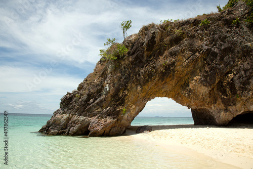 Natural stone arch with  beach at Kho Khai near Tarutao national park and Koh Lipe Thailand