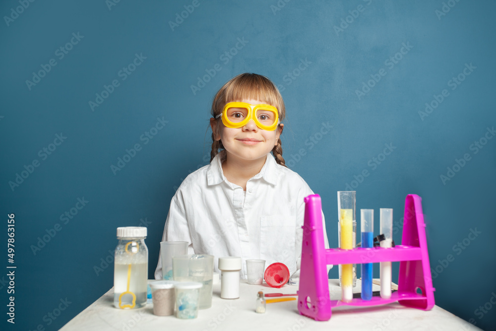 Learning science. Happy little child girl in science school Learning science. Happy little child girl in science school