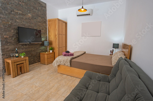 Modern bedroom area in a luxury studio apartment