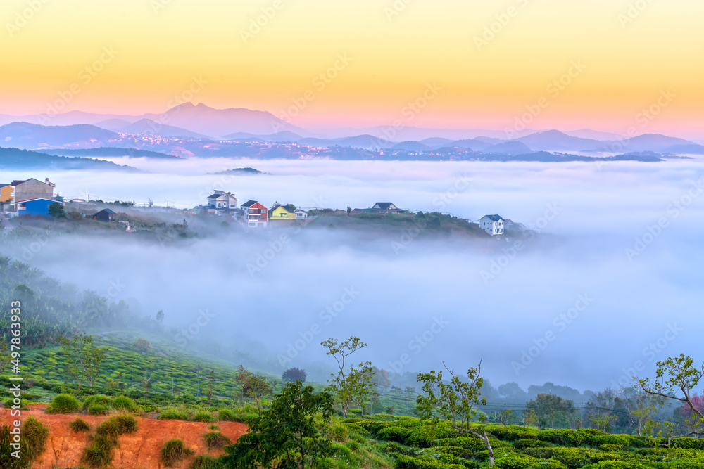 Morning landscape in a small town blurred in the morning mist with dawn sky background is peaceful in highlands Da Lat, Vietnam