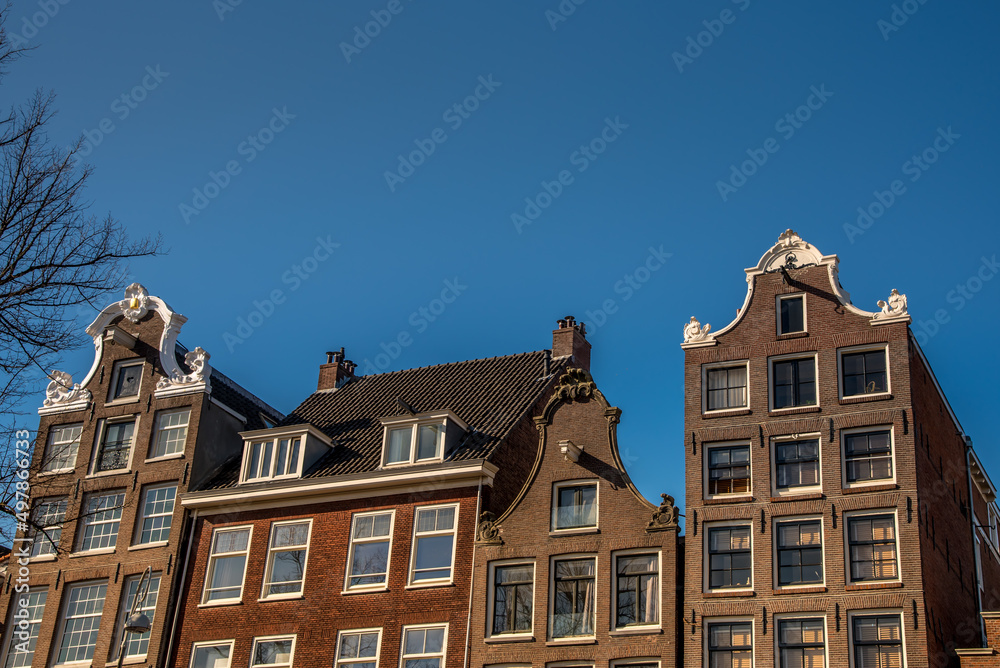 Amsterdam, Netherlands, April 2022. Historic facades along the canals of Amsterdam.