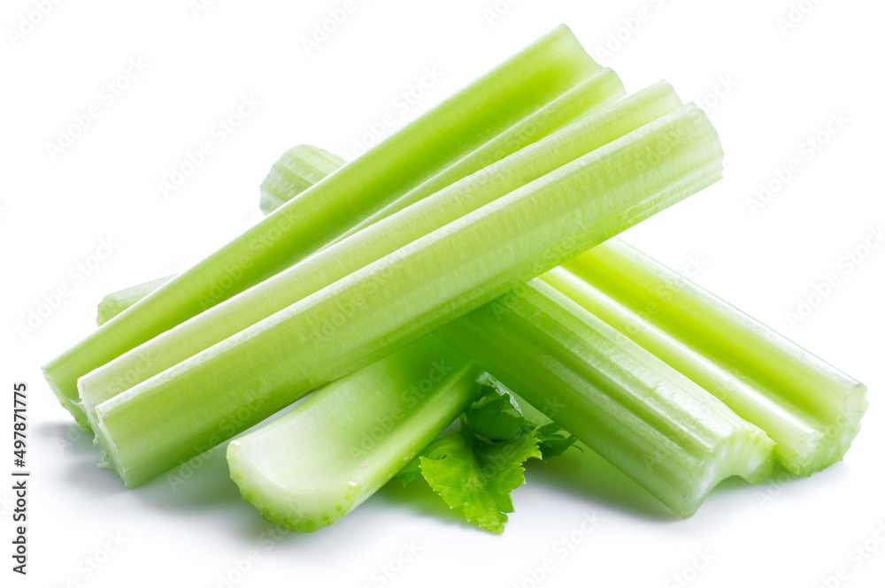 Pile of celery ribs and cuts isolated on white background. Pile of celery ribs and cuts isolated on white background.
